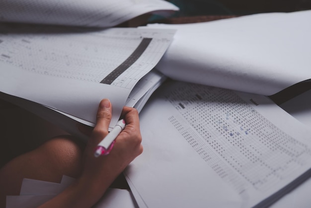 A close-up of an SAT practice test showing different sections (Reading, Writing, Math) with annotations and circled answers. The focus is on the test itself, highlighting the types of questions and the format of the exam.