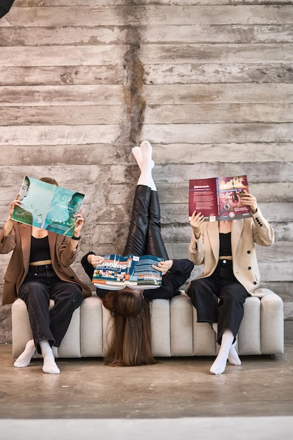 A collage of images showing various aspects of student life: a student studying in a dorm room, another receiving a diploma at graduation, and a group of students working together in a library.